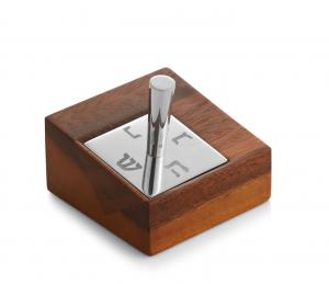 https://shalomhouse.com/wp-content/uploads/2018/10/nambe-dreidel-in-stand.jpg